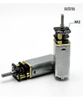 Premium DC Gear Motor With Smooth Low Rpm Reduction And Full Metal Housing Built Like A Tank For Robotics Mods, showing dual motors with metal housing and shafts.