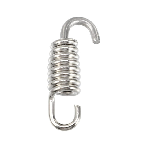 Close-up of a stainless steel motorcycle exhaust pipe spring with curved hooks.