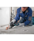 Person using 18V EC Brushless Oscillating Multi Tool With StarlockPlus Quick Change System For Fast Bit Changes on concrete