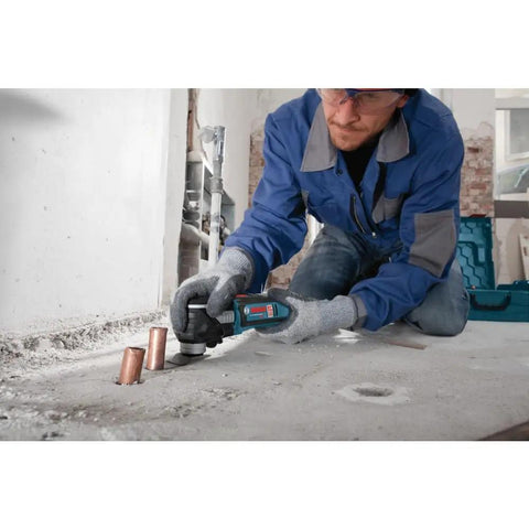 Person using 18V EC Brushless Oscillating Multi Tool With StarlockPlus Quick Change System For Fast Bit Changes on concrete