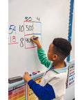 Child using Low Odor Dry Erase Markers With Vibrant Ink And Chisel Tip 16 Count on whiteboard in classroom setting.