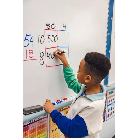 Child using Low Odor Dry Erase Markers With Vibrant Ink And Chisel Tip 16 Count on whiteboard in classroom setting.