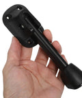 Hand holding component of Two Pack Folding Metal Table Legs For Dining Tables And Desks, Beefy Heavy Duty Iron Construction.