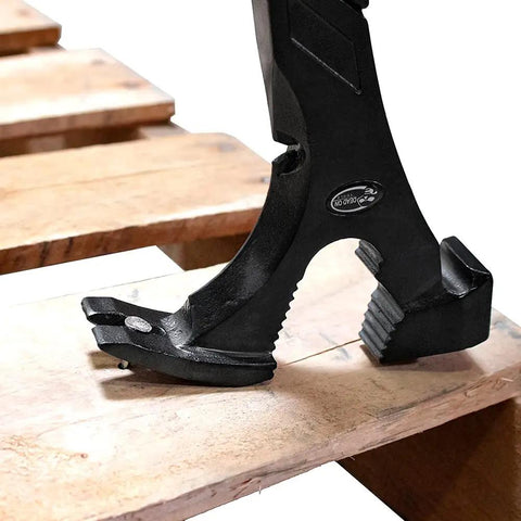 Close-up of 18 Inch Annihilator Utility and Wrecking Bar for Demolition and Concrete Forms gripping wood board