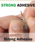 Close-up of hands holding a strong adhesive tab from Quick Fix Vertical Blind Repair Kit With Grippy Adhesive Tabs For Bent Or Snapped Slats.