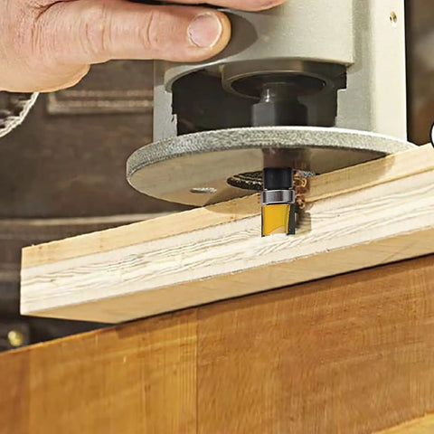 Pro Grade 4 Piece Flush Trim Router Bit Set With Top Bearing Quarter Inch Shank in use on wooden board