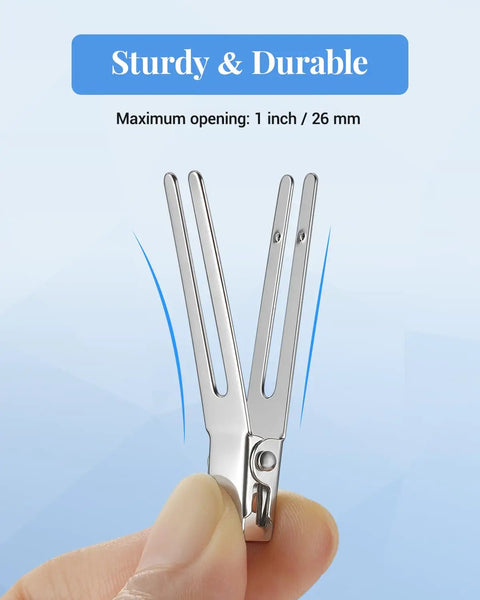 Close-up of a heavy duty metal pin curl clip in hand, showcasing maximum opening of 1 inch for effective styling. 50 Pack Heavy Duty Metal Pin Curl Clips With Three Essential Loc Combs For Strong Braid Support Flex And Twist Mastery That Slays On Every Crown.