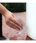 Person using Waterproof Self Adhesive Butyl Tape for Leak Repair on outdoor water container, 5cm by 5m, quick fix weatherproof seal.