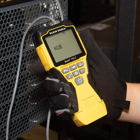 Person using Versatile On The Go Cable Tester Kit with Scout Pro 3 for testing connections on a equipment panel.