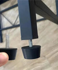 Rubber Adjustable Leveling Feet With Screws M6 M8 M10 For Tables And Chairs, close-up of foot being attached to furniture leg.