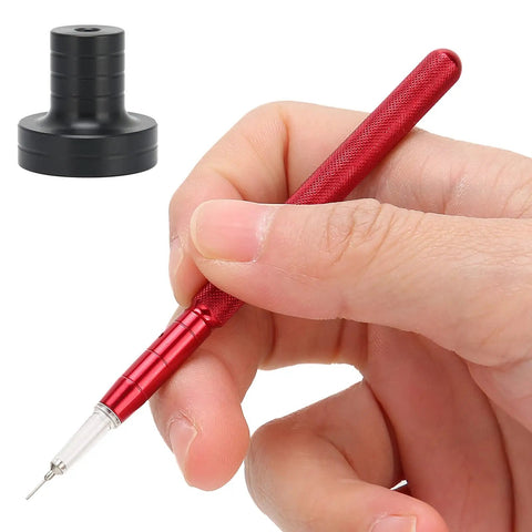 Hand using Watch Oiler Pen Pro Tool With Precision Oil Pin For Smooth Gear Movement, Includes Red Alloy Pen And Black Base close-up