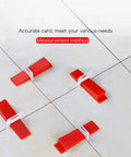 1000 Tile Leveling Clips For DIY Ceramic Tile And Stone Installations, Leveling Spacers For Floor And Wall Tiles, 1.5mm Grout Joint displayed on a tiled surface with red wedges.