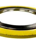 Close-up view of a yellow outer-ring spiral-wound gasket with stainless steel inner ring for a 38-inch pipe flange.