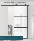 Super Slick Frosted Privacy Glass Barn Door Hardware Kit With Heavy Duty Track And Silent Rolling Wheels For Easy 36 By 84 Inch Sliding Install Plus Smooth Gliding Action Room Divider Setup mounted in a modern living space.