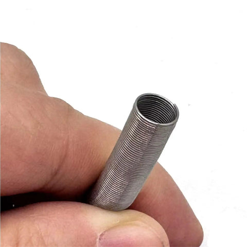 Heavy Duty Galvanized Steel Compression Spring Built Tough For Hydraulic Hose Shield and Silicone Tube Guard held in hand.