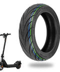10x2.30-6.5 Tubeless Tire For NIU KQi2 Pro Electric Scooter Front Or Rear Replacement All Weather Rugged Non Slip Durable Explosion Proof Wheel Tire For Easy Spare Tire Maintenance next to a NIU KQi2 Pro electric scooter.