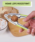 Person using Heavy Duty Nut And Shell Cracker Set With No Slip Grip Handles Seafood Tools And Picks to crack a walnut.
