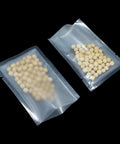 100 Pack Small Vacuum Sealer Bags 2.7x3.9 Inches Open Top Clear Pouches with textured back filled with white beads