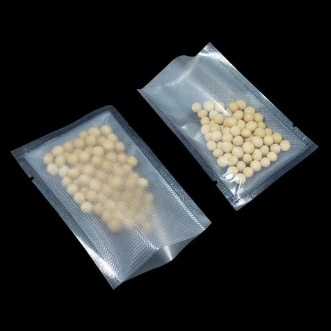 100 Pack Small Vacuum Sealer Bags 2.7x3.9 Inches Open Top Clear Pouches with textured back filled with white beads