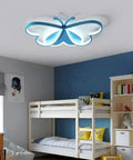 Butterfly LED Flush Mount Ceiling Light For Kids Room with blue light over bunk bed in children's bedroom