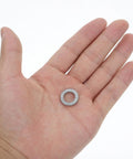 Set Of Twenty M10 Wedge Locking Washers Built Tough With Premium Manganese Steel held in hand, showing size and design for secure fastening.