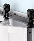 Close-up of Heavy Duty Bi Fold Barn Door Hardware Kit For Double Doors 3 Foot Track System installed with steel rollers