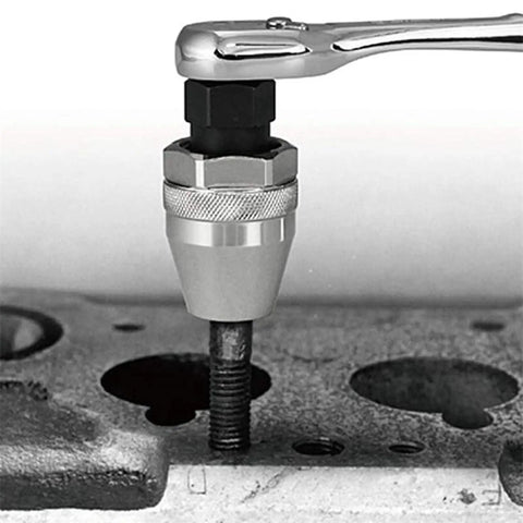 Gritty Bolt Breaker And Stud Extractor Kit For 3/8 Inch Drive loosening a rusted stud using a ratchet on machinery surface