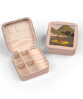 Open pink jewelry case with plush lining and compartments, featuring a lid image of Pink Cartoon Man On Ocean Rowing Inflatable Raft.