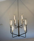 Retro Edison Look LED Filament Bulbs T10 Tubular 12W Dimmable warm glow in modern chandelier.