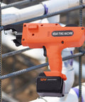 Workhorse Rebar Tie Gun 30 Mm To 60 Mm Cordless Tying Tool with pliers and charger in use on steel bars