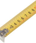 8m By 25mm Metric Gripper Tape With Nylon Coated Blade, Triple Riveted End Hook, detailed view of yellow metric scale.