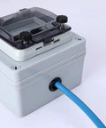 Blue cable passing through connector in electric box with 200 Piece Nylon Cable Snap Bushing Kit For Half Inch Holes Black