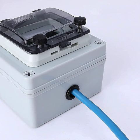 Blue cable passing through connector in electric box with 200 Piece Nylon Cable Snap Bushing Kit For Half Inch Holes Black