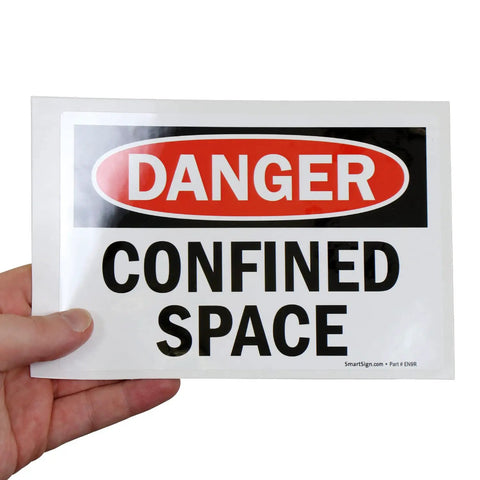 Danger Confined Space OSHA Sticker Labels 5x7 Inch 5 Mil Laminated Polyester With SuperStick Adhesive held in hand