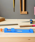 Grab These 2pcs Adjustable Wood Cutting Positioning Clamps For Your Circular Saw Rail on a workbench with tools.