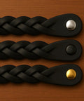Three braided leather drawer pulls in black with metal accents, 6.5-in length, shown on wood surface for dresser and cabinet use.
