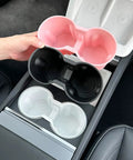 Slick Drop In Premium Soft Silicone Cup Holder Insert For Tesla Model 3 Highland 2024 And Up shown in three colors: pink, black, and white.