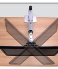 Full Motion Monitor Desk Mount Accommodates 17 To 32 Inch Displays featuring rugged aluminum spring arm view from above on wooden desk