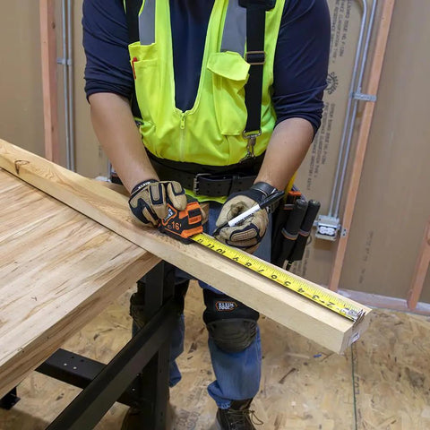 Worker using Rugged 16 Foot Tape Measure With Double Hook Double Sided Nylon Reinforced Blade And Metal Belt Clip