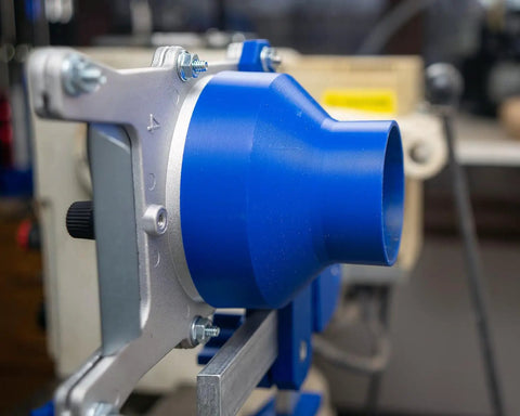 Close-up of Straight Up Industrial Dust Collection Adapter For Split Bed Wood Lathe with blue design and metallic mount.
