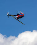 Fusion 700 Kit High Performance Super Combo with carbon 700mm rotor and 105mm tail blades flying against blue sky