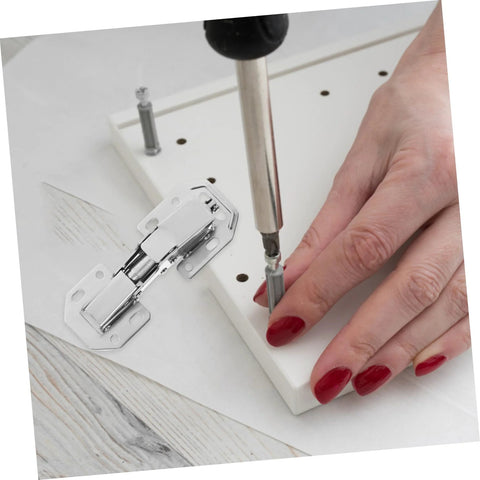 Installing concealed cabinet hinges on white furniture piece