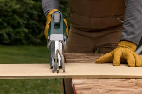 Pro Grade Heavy Duty Electric Fiber Cement Siding Cutter With Six Point Five Amp Motor cutting through board on a workbench.
