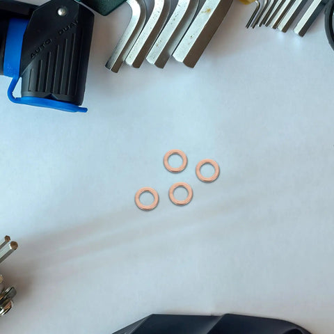 40 Pcs Copper Crush Sealing Washers Kit 0.4 Inch Flat Copper Gaskets on white surface with tools nearby