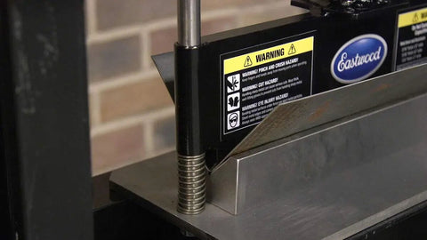 Heavy Duty Press Brake Attachment For Standard 12 To 20 Ton Hydraulic Shop Presses showing close-up of steel bending process