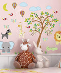 Kid Friendly Jungle Animal Wall Stickers Set With DIY Monkey Elephant Giraffe Zebra Lion Bird Tree Moon And Hot Air Balloon Vinyl Forest Decor For Baby Nursery Kids Room Removable Non Toxic Safe For Children featuring jungle animals, tree, and hot air balloons on a nursery wall.