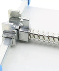 Close-up of adjustable PCB circuit board holder mechanism with stainless steel components and spring clamp, part of 120x80mm platform.