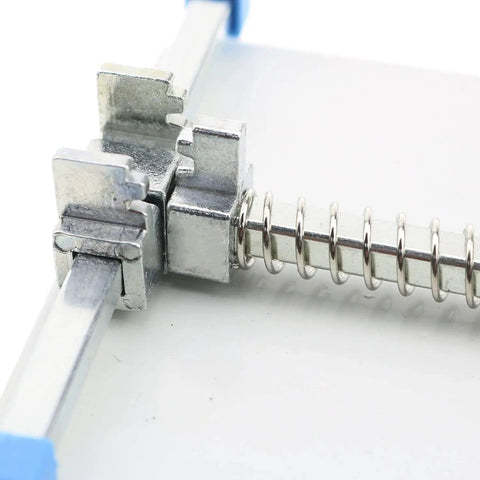 Close-up of adjustable PCB circuit board holder mechanism with stainless steel components and spring clamp, part of 120x80mm platform.