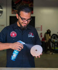 Man demonstrating use of Quantum Best Of The Best Buffing And Polishing Pad Kit For Auto Detailing Eight Pad Set With 6.5 Inch Pads