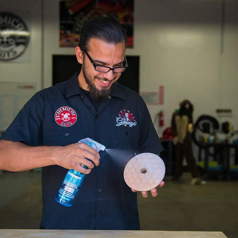 Man demonstrating use of Quantum Best Of The Best Buffing And Polishing Pad Kit For Auto Detailing Eight Pad Set With 6.5 Inch Pads